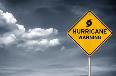 A sign reads: hurricane warning